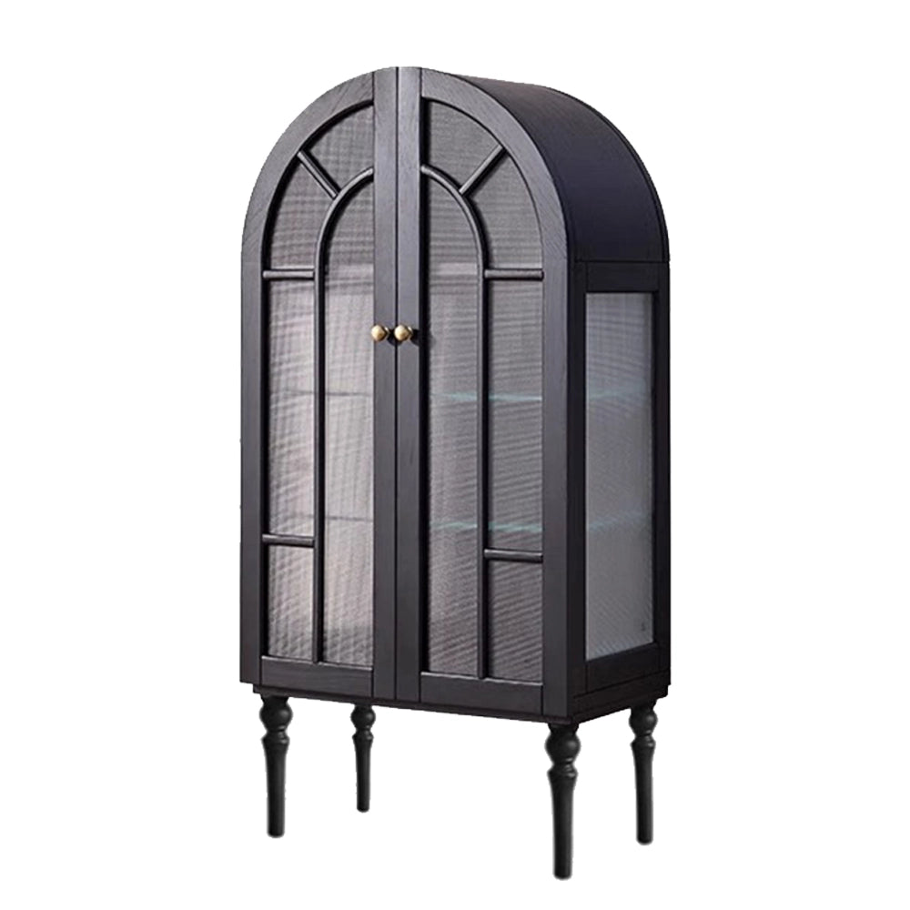 Black arched glass display cabinet with double doors and turned legs on a white background.