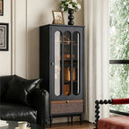 Tall black display cabinet with three elongated glass panels, a brown lower drawer and turned legs.