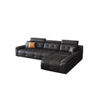 Compact black sectional sofa configuration with a right-side chaise and padded headrests.