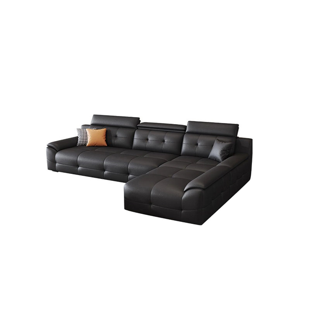 Compact black sectional sofa configuration with a right-side chaise and padded headrests.