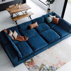 Overhead room view of the blue modular sofa's deep seating area and mixed accent pillows.