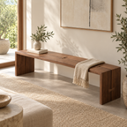 Long brown bench with slab sides and butterfly-shaped joint accents, styled with a throw and vase.