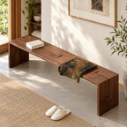 Overhead angled view of the brown bench's split seat surface and butterfly-shaped joint accents.