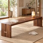 Angled room view of the brown bench showing a butterfly-shaped accent across the seam in its side.