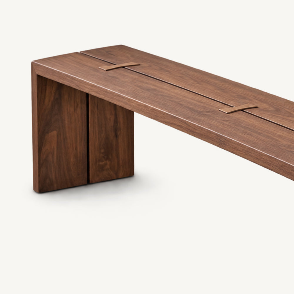 Angled detail of the brown bench top showing its long seam and butterfly-shaped joint accents.