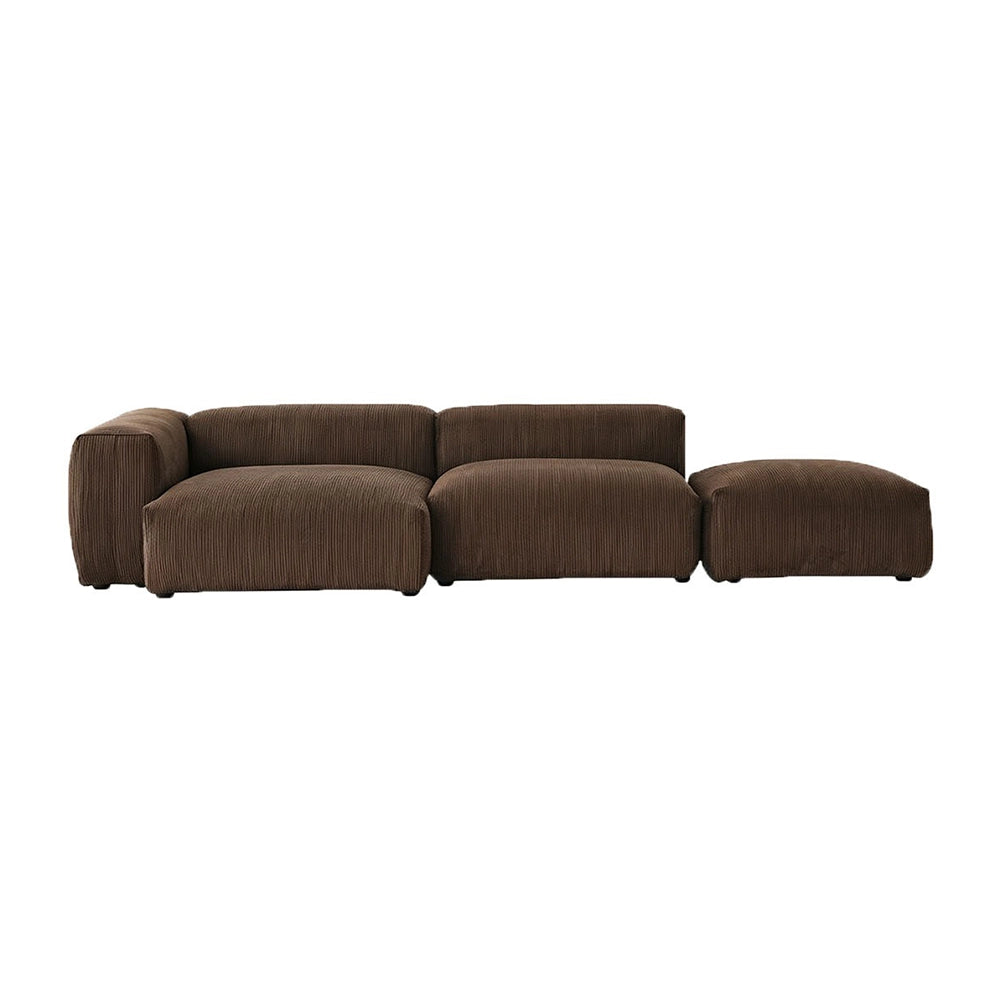 Brown modular sofa with two seat sections and a matching ottoman aligned alongside.
