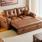 Brown tufted sofa bed with its pull-out sleeping section extended and padded rolled arms.