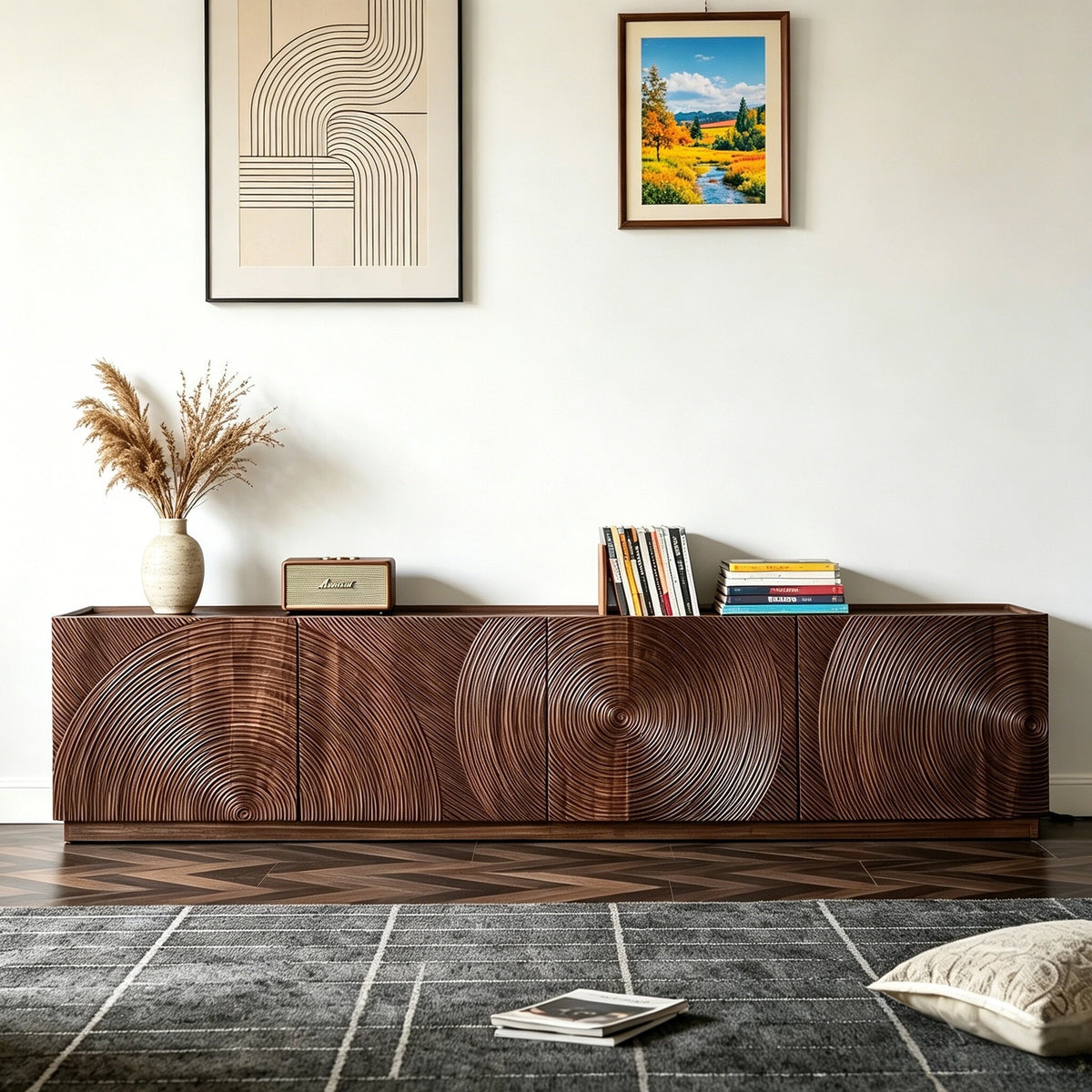Brown TV cabinet with concentric circular patterns across its doors, styled with books and vases.