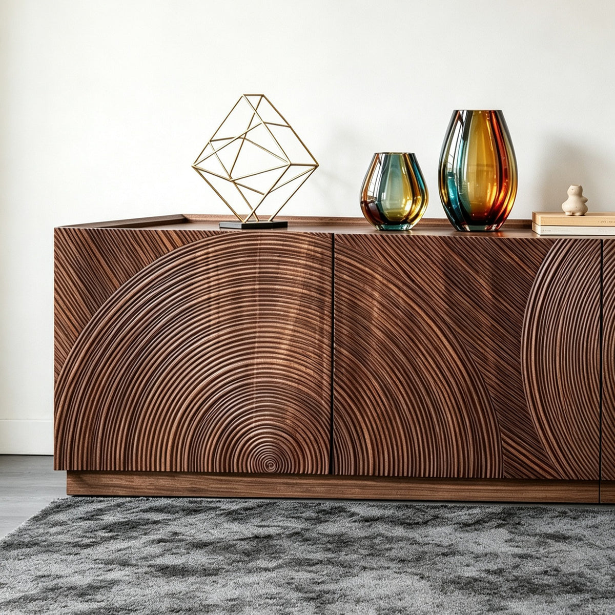 Close-up of the TV cabinet's concentric curved door grooves beneath colorful glass vases.