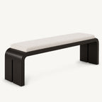 Long cream-cushioned bench with a black rounded frame and split slab side supports.