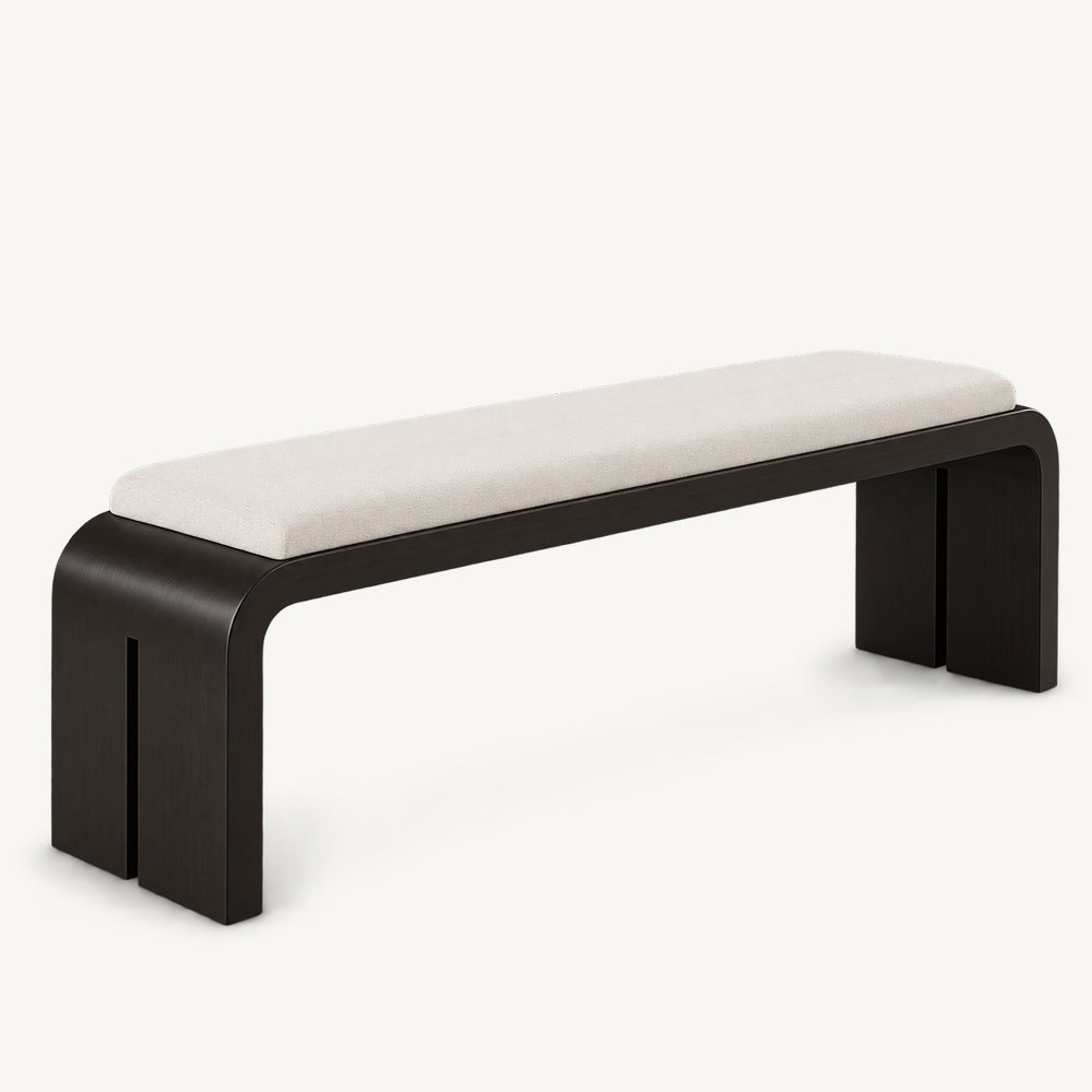 Long cream-cushioned bench with a black rounded frame and split slab side supports.