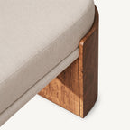 Detail of the cream bench cushion and shaped brown support edge.