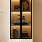 Detail of the cabinet's illuminated display shelves behind black-framed glass doors.