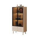Tall wide cream glass display cabinet with three display levels and fluted drawers on a white background.