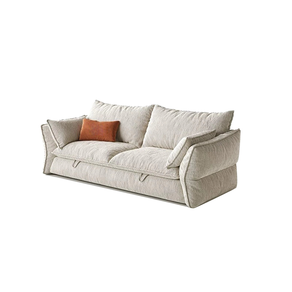 Wide cream sofa bed with loose back cushions, padded arms and front pull loops.