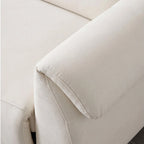 Close-up of the cream sofa's padded arm cushion and stitched upholstery edge.
