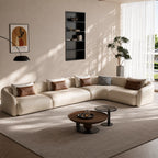 Cream modular sofa with a corner section on the right as pictured and rounded upholstered arms.