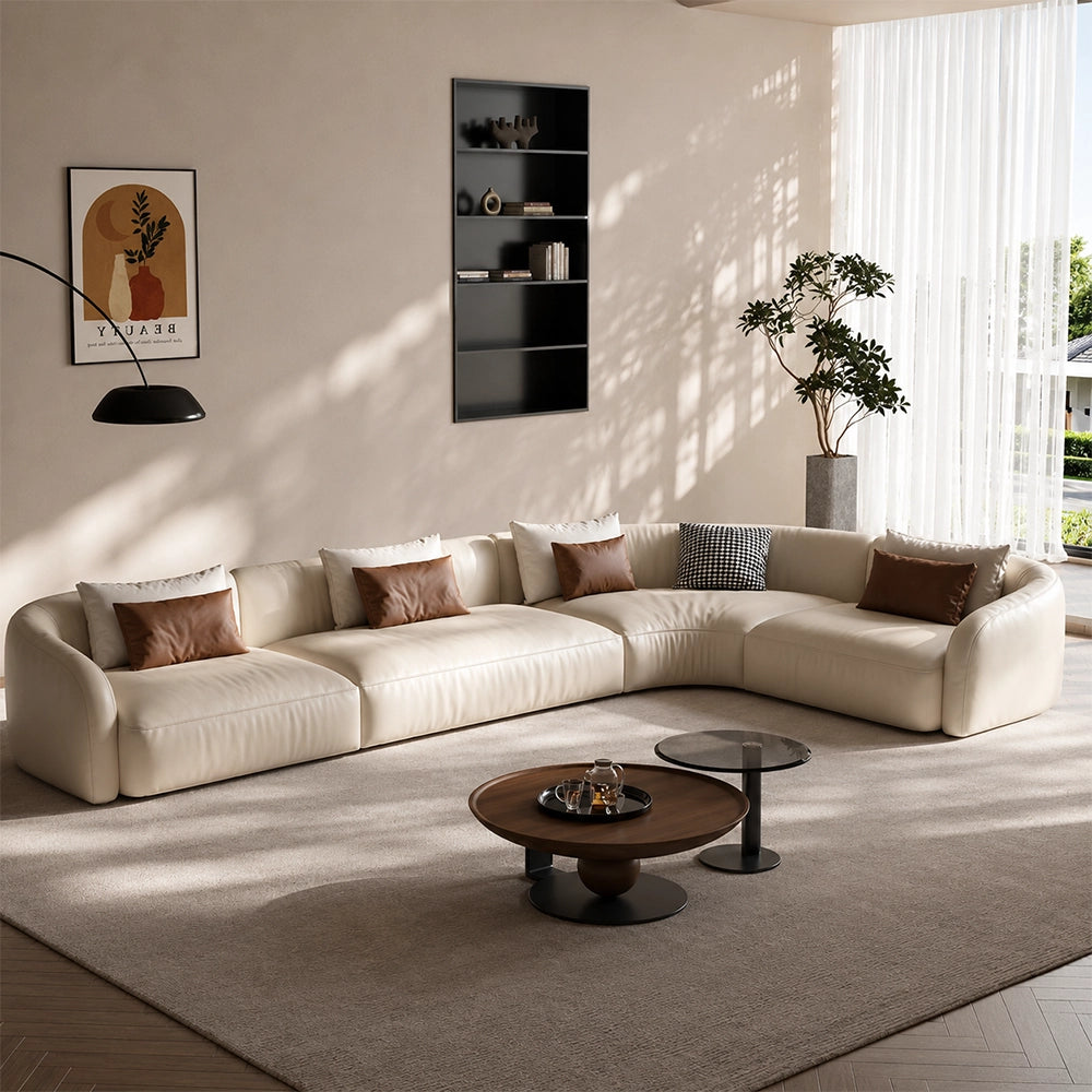 Cream modular sofa with a corner section on the right as pictured and rounded upholstered arms.
