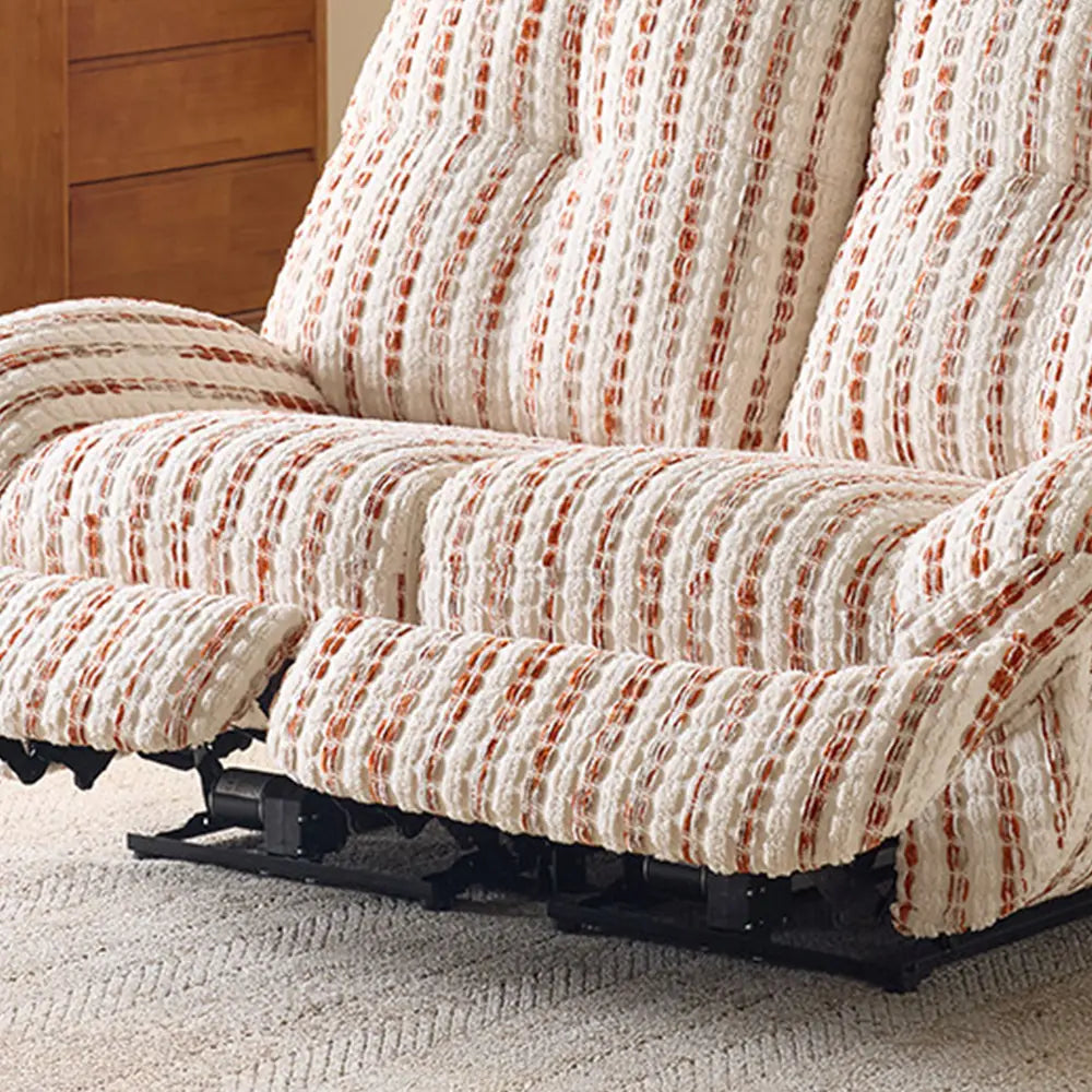 Close-up of the striped loveseat's extended footrests and dark support mechanism beneath the seats.