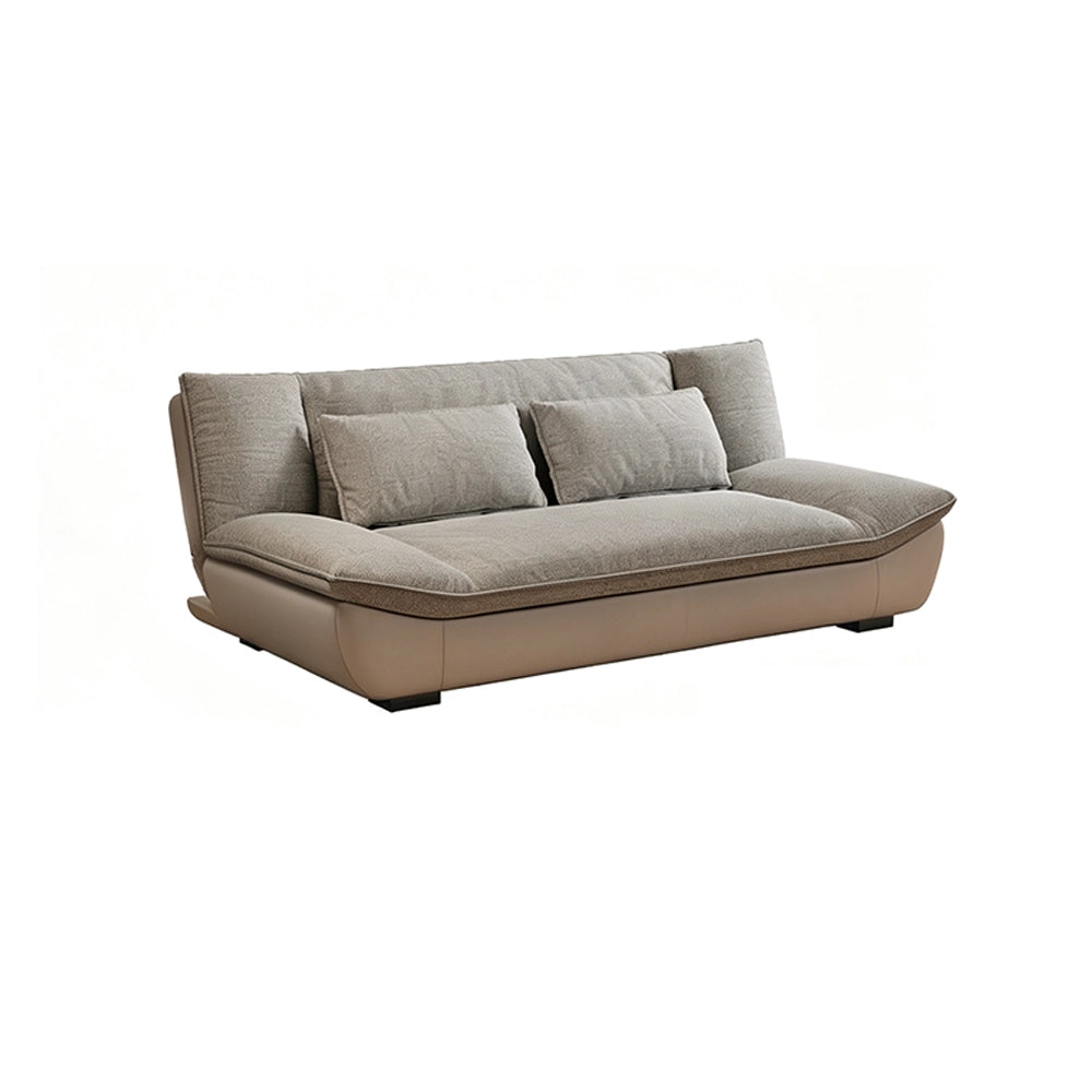 Gray cushioned sofa with a curved taupe base and rounded arms on a white background.