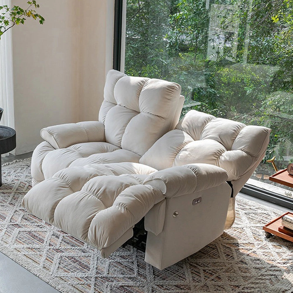 Cream reclining loveseat with one backrest lowered and one upright, showing deeply padded seat and arm cushions.