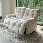 Cream two-seat reclining loveseat in upright form beside garden-facing windows.