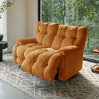 Orange deeply cushioned reclining loveseat in upright form beside garden-facing windows.