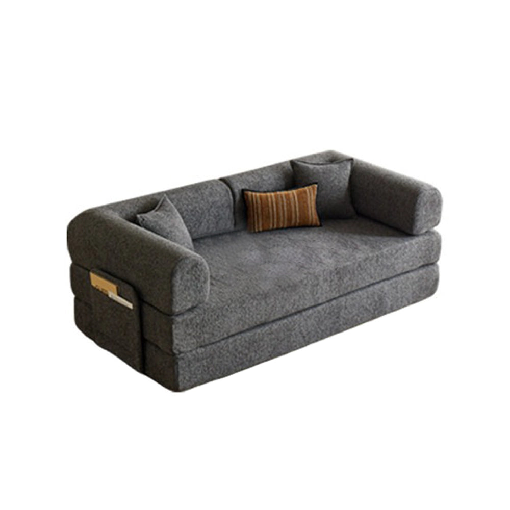 Gray fold-out sofa bed with stacked cushions and rounded arms on a white background.