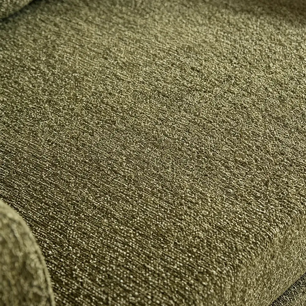 Close-up of the green sofa bed upholstery showing its woven texture.