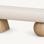 Front detail of the cream textured bench seat above its two light wood-tone geometric supports.