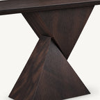 Detail of the console table's intersecting triangular base panels and visible grain.