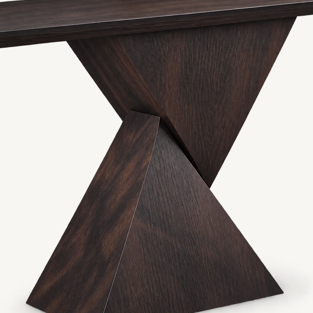 Detail of the console table's intersecting triangular base panels and visible grain.