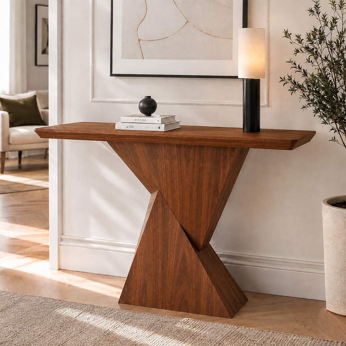 Warm brown version of the geometric-pedestal console table, styled with a lamp and books.