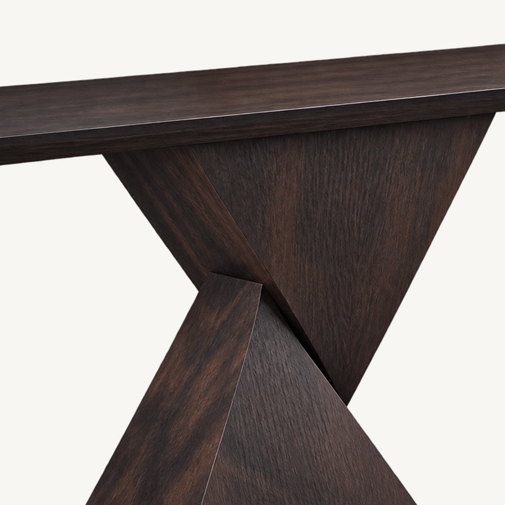 Close-up of the geometric console pedestal where its two angled panels cross beneath the top.