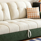 Close-up of the cream tufted seat and back cushions above the green sofa bed base.