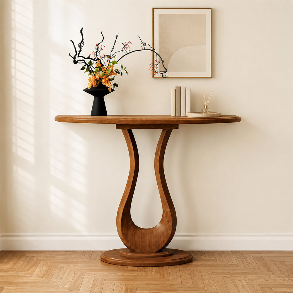 Front view of the brown console table with a curved tabletop and loop-shaped central pedestal.