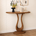 Angled view of the half-moon console table against a pale wall, with an oval base.
