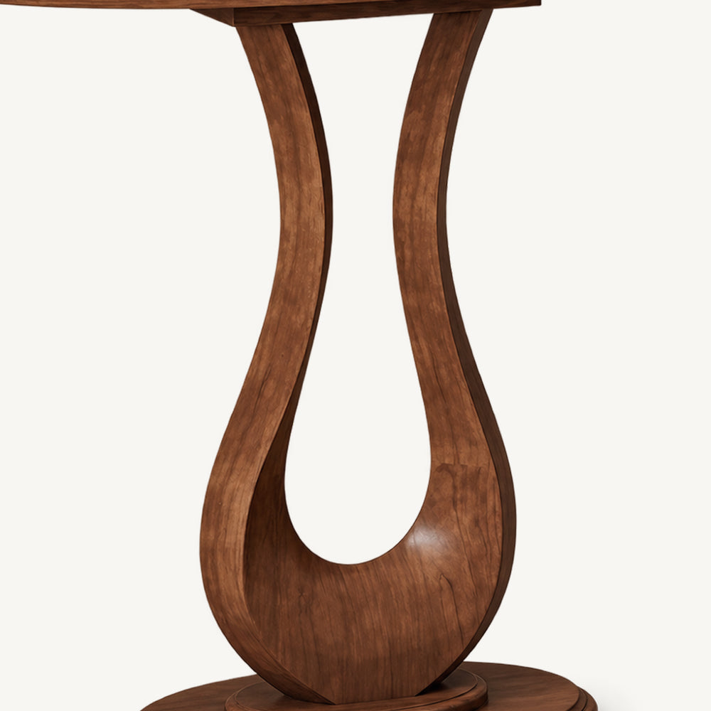 Close-up of the brown console table's open loop pedestal and visible grain.
