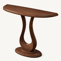 Brown wood-tone half-moon console table with an open sculptural pedestal and oval foot.