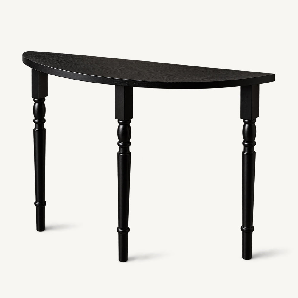 Black half-moon console table with a slim curved top and three turned legs.