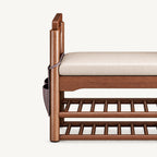 Front detail of the shoe bench's cream cushion, round upright support and lower slatted racks.