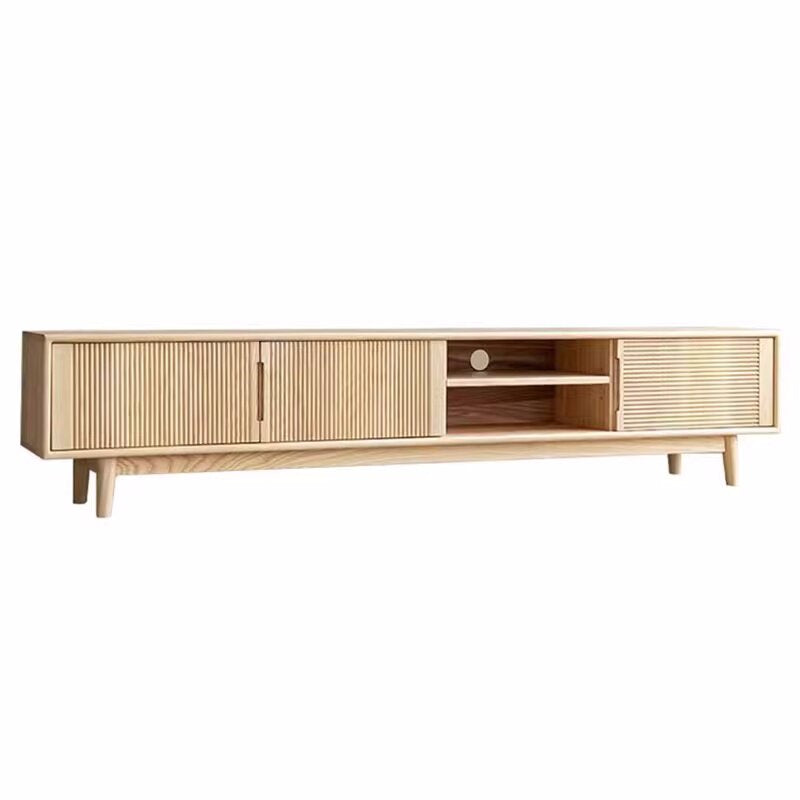 Light wood-tone media console with fluted storage fronts and open shelves including a circular cable opening.