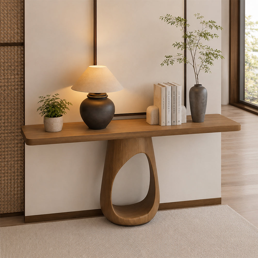 Front view of the narrow wood-tone console table with a teardrop-shaped opening in its central base.