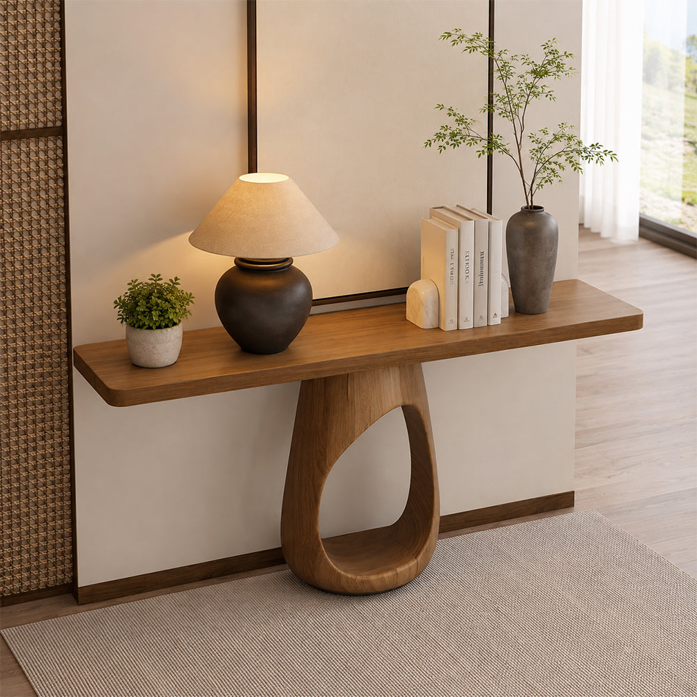 Angled entryway view of the loop-base console table, with a narrow rectangular top and rounded corners.