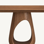 Front detail of the console table's wood-grain pedestal and curved opening beneath the narrow top.