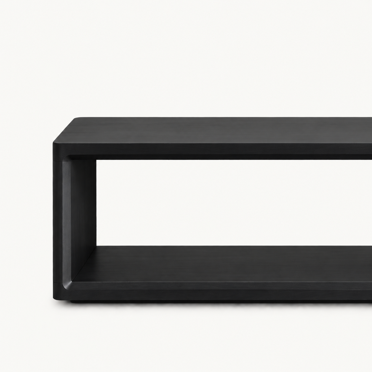 Close-up of the black bench's front frame corner and open shelf.