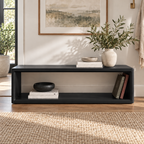 Front view of the black open-frame bench with a long rectangular storage opening.