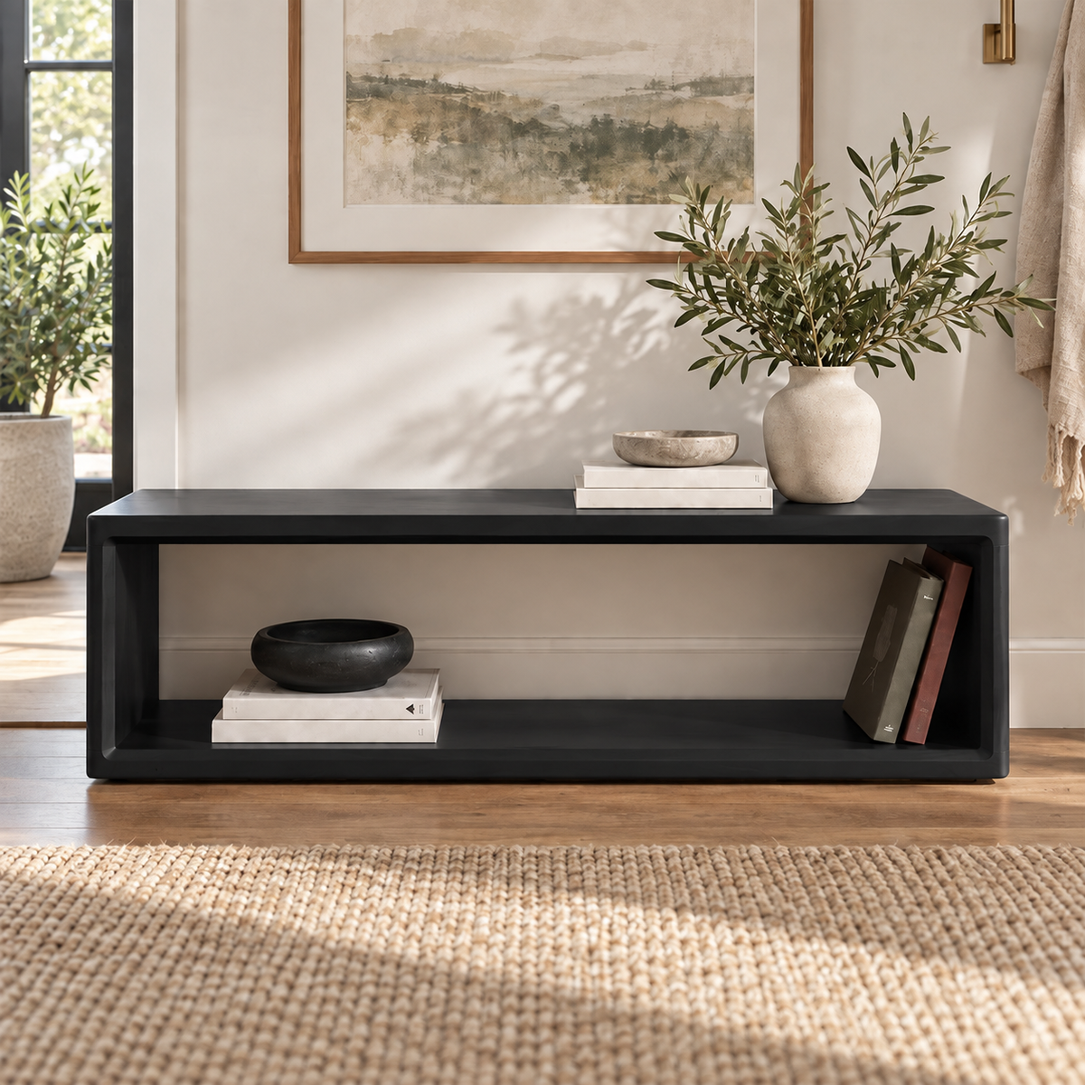 Front view of the black open-frame bench with a long rectangular storage opening.