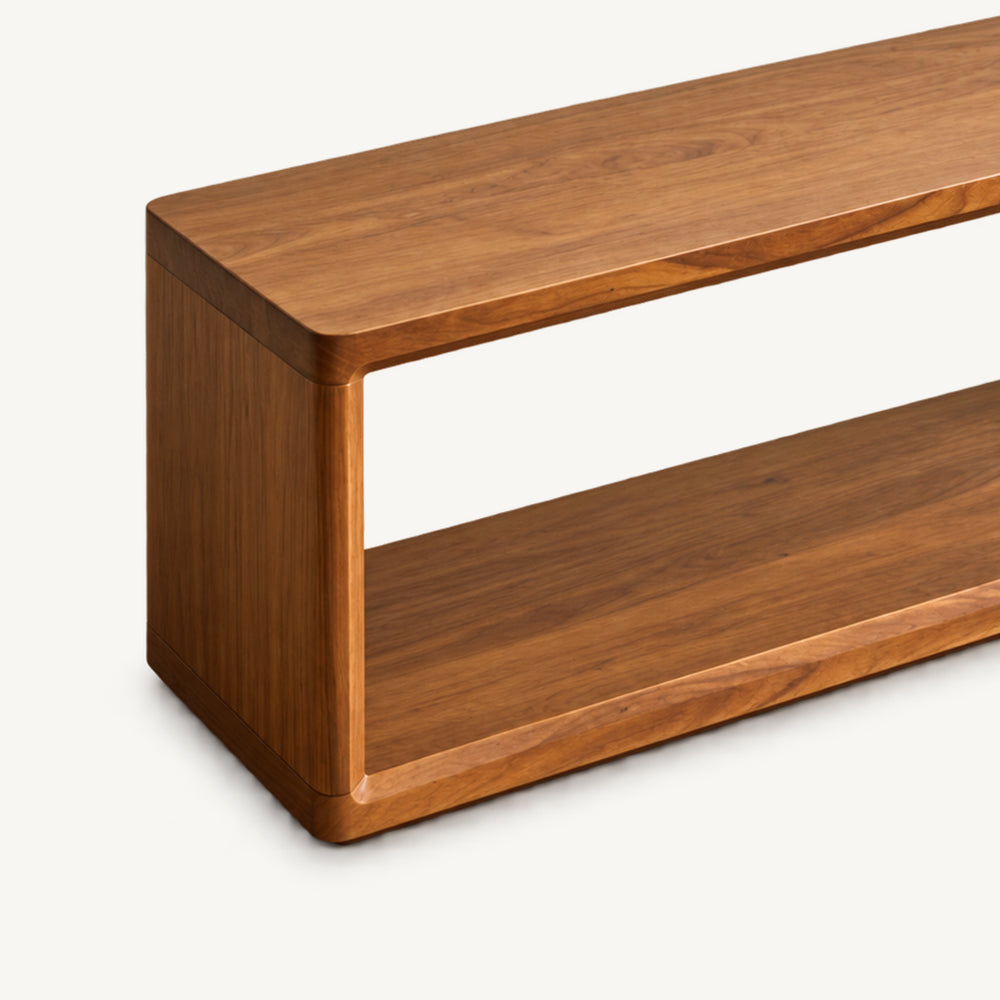 Detail of the brown bench's outer side panel and rounded top corner.