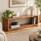 Brown open-frame bench with a long lower shelf, styled beside plants and a floor lamp.
